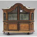 A 19th century Dutch walnut and marquetry inlaid arched wall cabinet, fitted with a pair of glazed