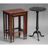 An Edwardian mahogany nest of three occasional tables with chequered stringing, on turned feet,