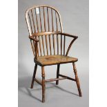 A late 19th century provincial ash, beech and fruitwood hoop and spindle back Windsor armchair,