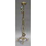 An Edwardian Art Nouveau brass lamp standard on scroll legs, height 146cm.Buyer’s Premium 29.4% (