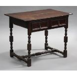 An early 18th century and later oak lowboy, fitted with two frieze drawers, raised on turned and