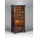 An unusual George III mahogany narrow chest of eight graduated drawers, raised on bracket feet,