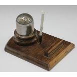 A Morris Motors Ltd inkwell with nickel plated body, hinged domed lid and ceramic ink container,