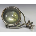 A Phares Besnard 'Les Vestales' stirrup-mounted acetylene spot lamp with mirrored reflector, the