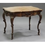 A late 19th century Continental walnut writing table, the serpentine moulded top above a single