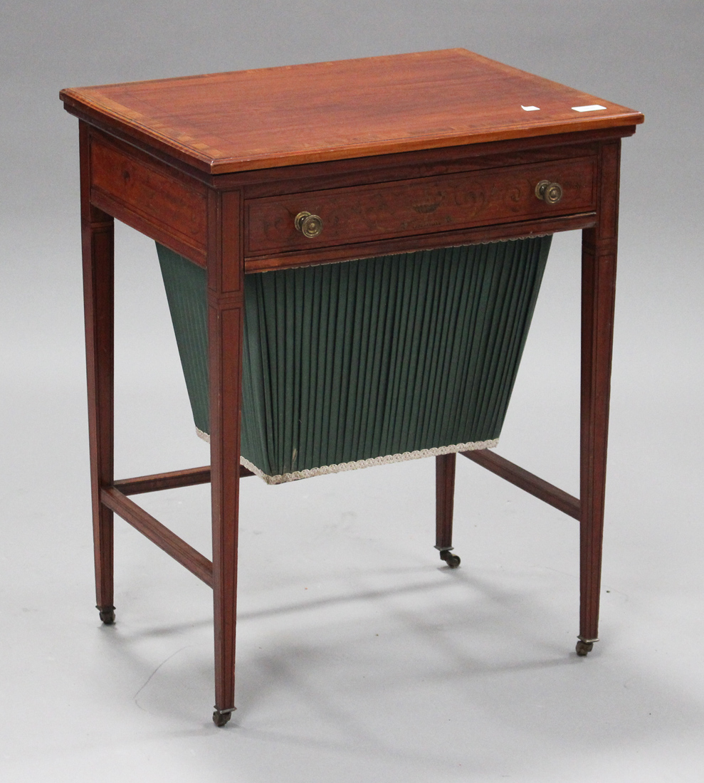 An Edwardian satinwood and foliate inlaid fold-over work/games table, possibly by Edwards & Roberts,