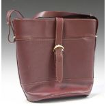 A Must de Cartier burgundy leather handbag, width 31cm, together with original outer slip case.