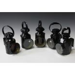 A group of five black painted tin railway lamps, some marked 'BR' (later painted and faults).Buyer’s