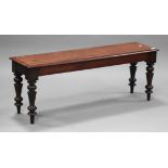 A 19th century mahogany window seat, the moulded top raised on turned legs, height 46cm, width