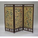 A late 19th century rosewood framed three-fold draught screen, the three panels with overall applied