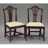 A set of six late George III mahogany pierced splat back dining chairs with drop-in seats, on square