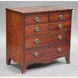 A George III mahogany chest of two short and three long drawers, on outswept bracket feet, height