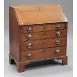 An 18th century oak bureau, the fall front revealing a fitted interior above four long drawers, on
