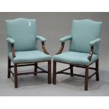 A pair of late 19th century George III style padouk framed armchairs, upholstered in green fabric,