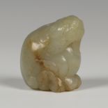 A Chinese jade figure of a seated Buddhistic lion, probably late Qing dynasty, the stone of