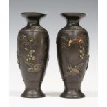 A pair of Japanese brown patinated bronze and mixed metal vases, Meiji period, each decorated in