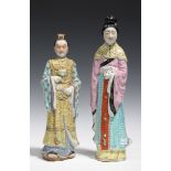 A Chinese famille rose enamelled biscuit porcelain figure of a standing female dignitary, mid-20th