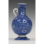 A Japanese blue and white porcelain single-handled bottle vase, Meiji period, the globular body,