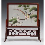 A Chinese hardwood framed table screen and stand, 20th century, the rectangular frame enclosing a