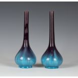 A pair of Chinese purple and turquoise glazed bottle vases, 19th century, each low bellied body