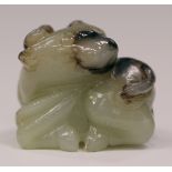 A Chinese Suzhou style jade pendant, carved in the form of a buffalo calf, the stone of greyish