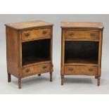 A pair of late 20th century reproduction walnut bedside tables, the shaped tops above drawers and