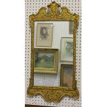 A late 20th century George I style gilt wall mirror, the shaped frame decorated in relief with