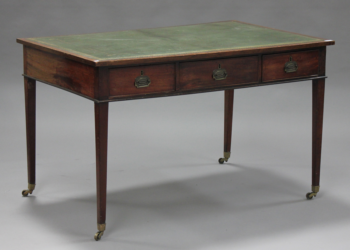 A 19th century George III style mahogany library table, the top inset with a green leather writing