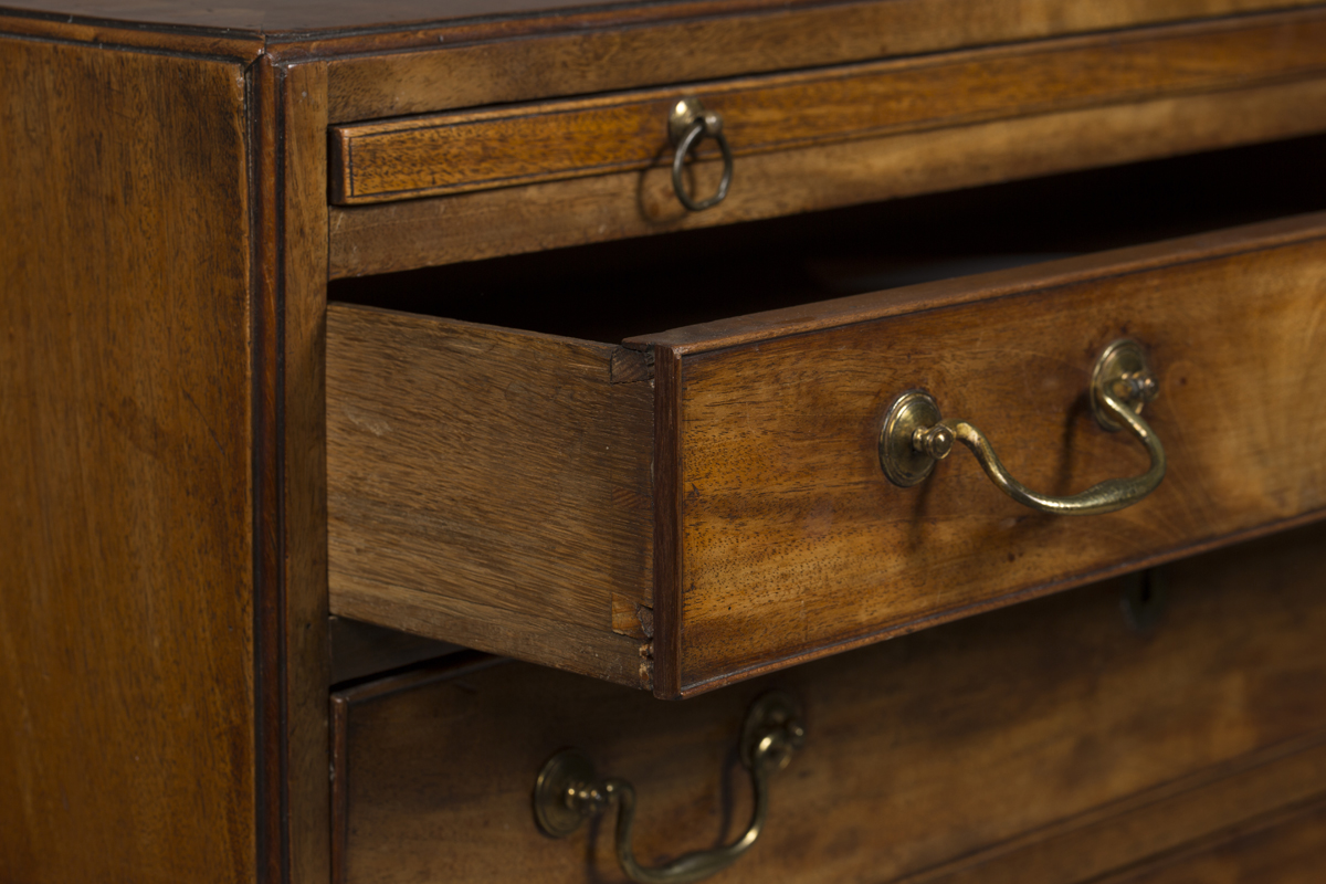 A George III mahogany bachelor's chest of four graduated long drawers, the crossbanded top above a - Image 2 of 2
