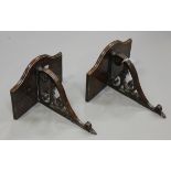 A pair of late Victorian mahogany wall brackets with pierced and carved foliate scrolling