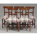 A harlequin set of eleven George III mahogany canted bar back dining chairs, comprising two