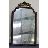 A 20th century Queen Anne style mahogany wall mirror, the arched cushion moulded frame with a