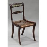 A Regency rosewood and brass inlaid side chair, the carved bar back and centre rail with inlaid