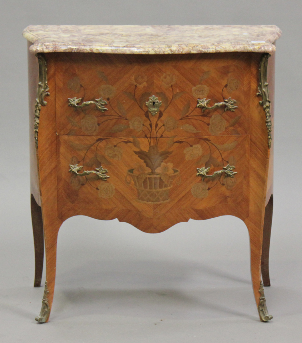 A late 20th century French kingwood and gilt metal mounted bombé commode, the moulded marble top