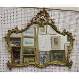 A 20th century rococo style gilt framed overmantel mirror with pierced foliate surmount, 107cm x