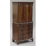 A 20th century mahogany serpentine fronted drinks cabinet on bracket feet, height 153cm, width