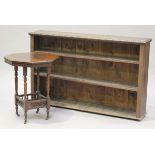 A late Victorian oak open bookcase, the carved top above three adjustable shelves, height 94cm,