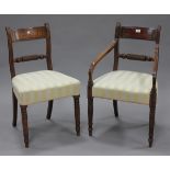 A set of six Regency figured mahogany and brass inlaid bar back dining chairs, comprising a single