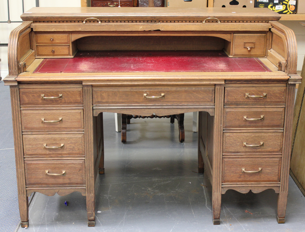 A 20th century oak roll-top desk, the tambour front revealing a fitted interior above an arrangement - Image 2 of 2