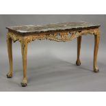 A 20th century Continental marble-topped centre table with carved and pierced scroll apron, on