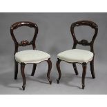 A set of eight modern Victorian style stained hardwood spoon back dining chairs with upholstered