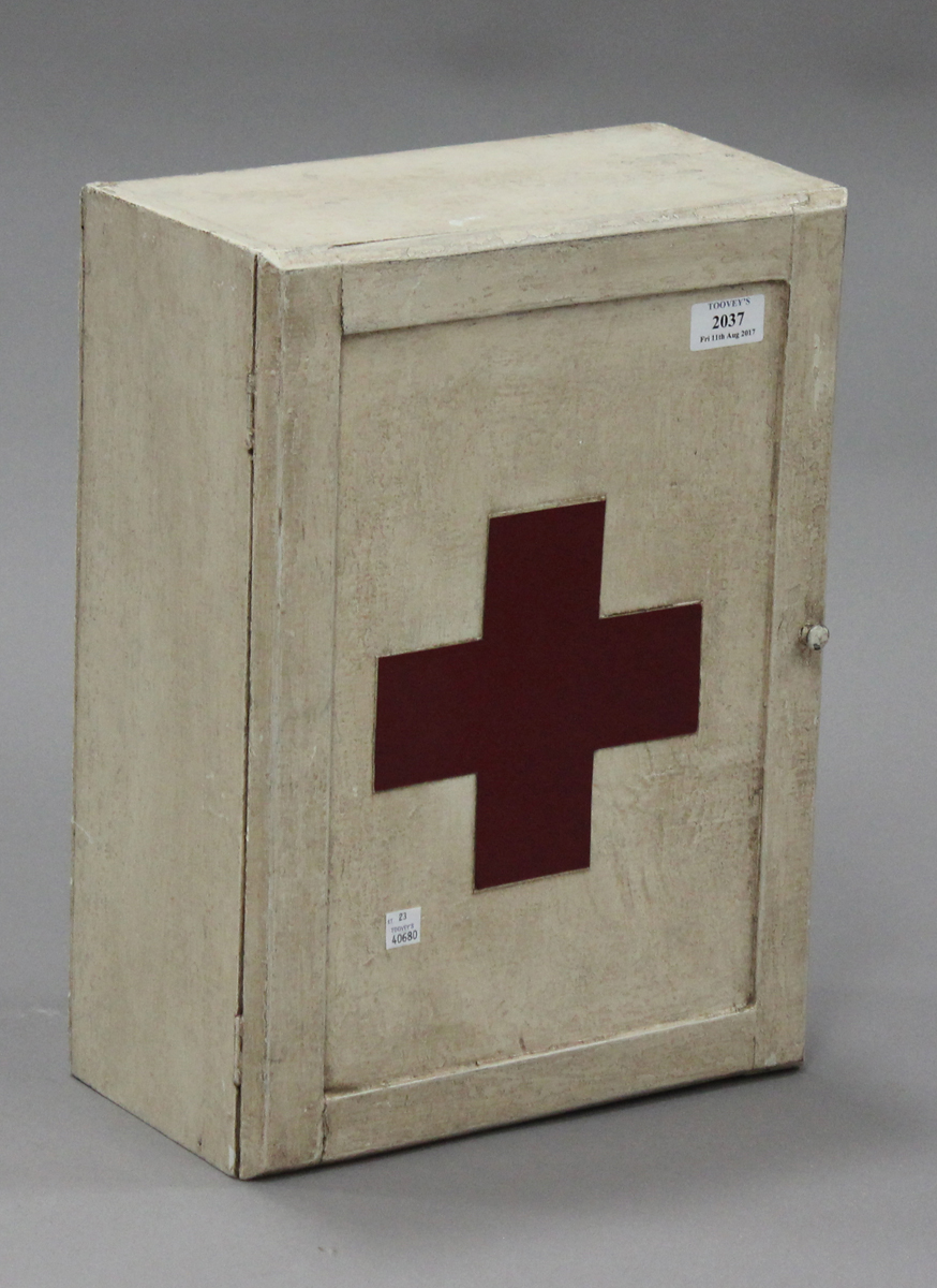 A 20th century wall mounted first aid cabinet, height 41cm, width 31cm.Buyer’s Premium 29.4% (