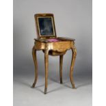 A mid-Victorian burr walnut and gilt metal mounted jewellery table, the triple hinged top