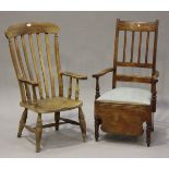 A 20th century beech and elm bar back Windsor armchair, the solid seat raised on turned legs, height