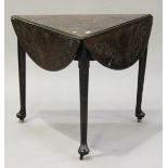 An 18th century and later mahogany triangular drop-flap table with later carved decoration, raised