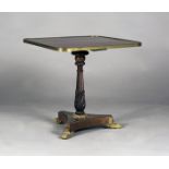 A Regency rosewood and brass inlaid wine table, the rectangular top with an applied brass rim