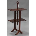 An Edwardian mahogany folding cake stand on outswept legs, height 96cm.Buyer’s Premium 29.4% (