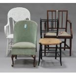 A 19th century mahogany open armchair with drop-in seat, together with an ebonized side chair, a