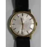An Omega gentleman's gilt metal fronted and steel backed wristwatch, the signed silvered dial with