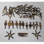 A collection of forty-four pocket and fob watch keys, including six advertising examples and two